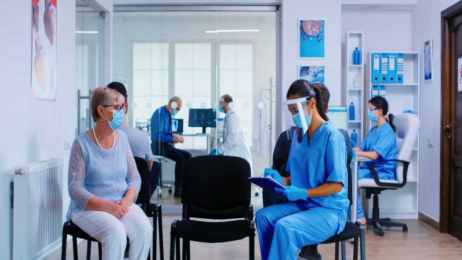 Nurse meeting with patient in waiting room